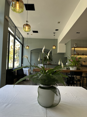 Cookaki interior dining room with warm lighting and historic 1956 character in Koukaki, Athens