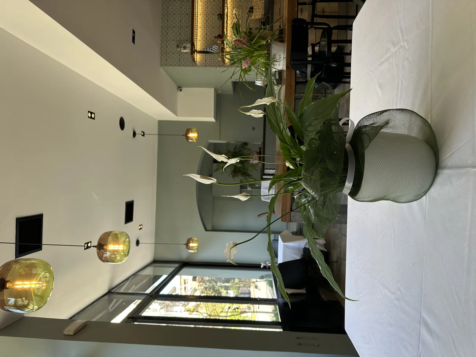 COOKaki interior dining room with warm lighting and historic 1956 character in Koukaki, Athens