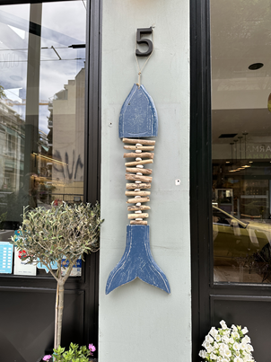 Blue fish detail above the entrance of Cookaki Bell Kitchen, Petméza 5 Athens